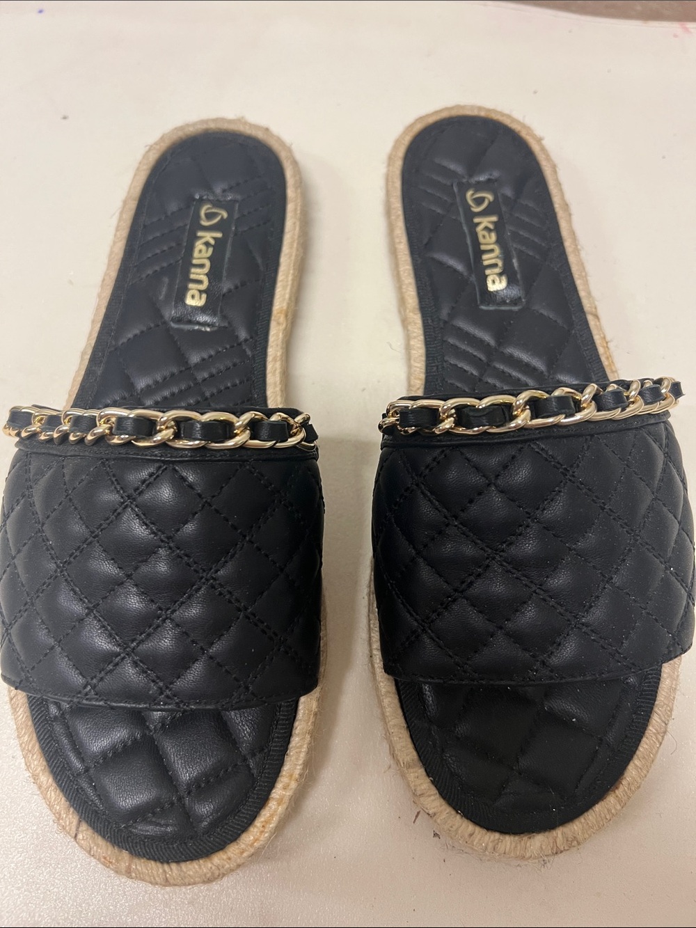 kanna Black Quilted Slide Mules with Gold Chain Trim